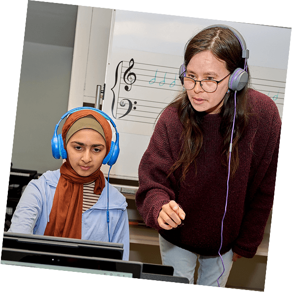 A piano teacher and student look at the keyboard during a lesson in Pasadena.