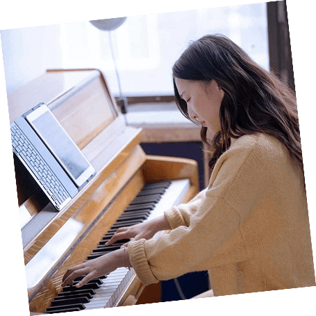 Learning to play favorite songs and modern music in an adult piano program.